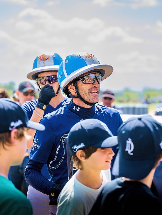 La Dolfina player with students